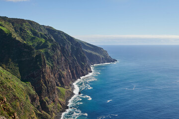Fototapeta na wymiar Cliffs, Atlantic Occean and blue sky on sunny day, Madeira, Portugal