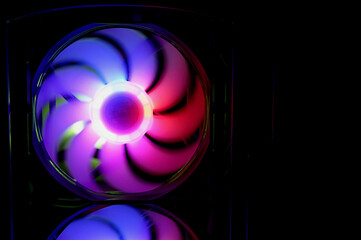 Computer cooler with RGB LED light. Computer circuit board and CPU cooling fans illuminated