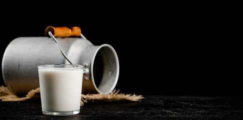 Fresh homemade milk on the table in a glass. 