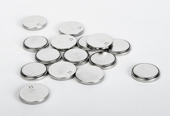 Button batteries, cells of circle round shape for electricity. Pile, heap, hazardous waste concept. High quality photo