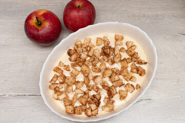 Mixing Ingredients for baking apple cake. Step-by-step recipe for apple pie. Step 4
