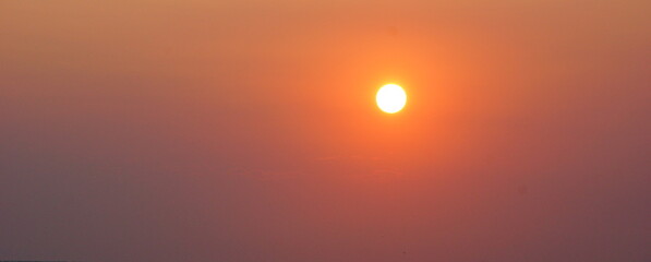 disk evening sun orange sunset. evening sky sun background