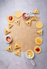 Dough, Jam, Sugar, Butter, Rolling Pin on Gray Stone Table. Purim Celebration, Jewish Carnival Holiday Concept.