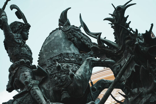 Stockholm, Sweden - 10 10 2022: Bronze replica of the statue of St. George and the Dragon. Work by Bernt Notke for the Battle of Brunkeberg. Triumphal monument in a square of the Scandinavian capital.