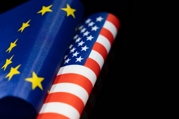 flags of the USA and European Union on a black background. The concept of interaction or...