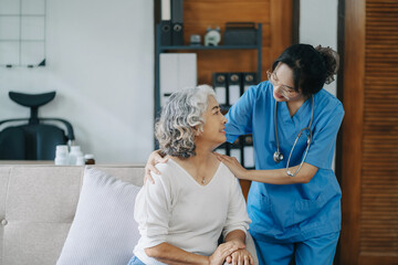Fototapeta premium Female doctor touching patient's shoulder to encourage treatment.
