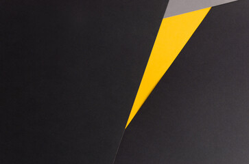 Black background with yellow and gray triangle