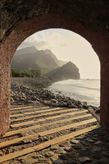 A small passageway drilled into the rock connects two sectors of the La Aldea Beach in Gran Canaria. Inside the tunnel you get a mysterious panoramic view of the cliffs