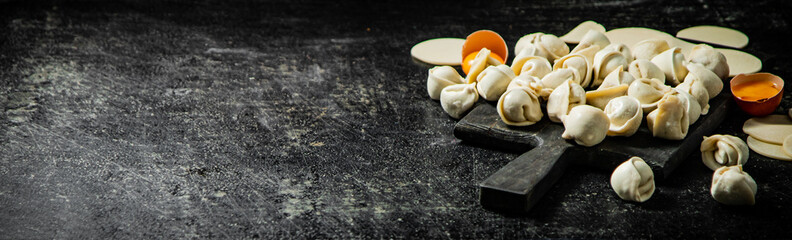 Dumplings with raw egg and pieces of dough. 