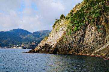 Scenic nature landscape view of beautiful rocks descend into the Ligurian Sea. Sea landscape with...