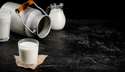 Fresh country milk in a glass on the table. 