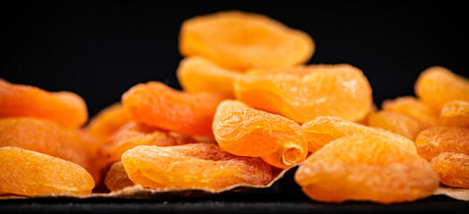A bunch of dried apricots on the table. 