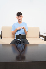 Deaf young latin male, has a video call conversation through a smartphone cell phone. Inclusion...