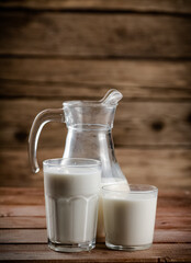 Milk in jugs and glasses. 