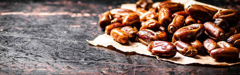 A pile of dates on paper on the table. 