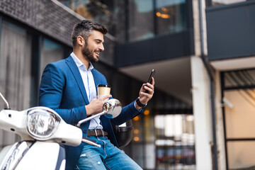 Portrait of modern businessman with phone
