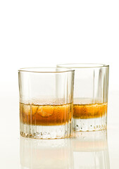 two glasses of  whiskey on the rocks