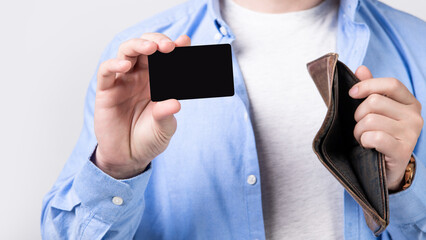credit or debit card and wallet in hand. photo of credit or debit card with copy space.
