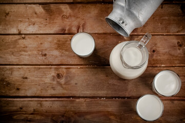 Milk in jugs and glasses. 