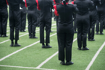 Obraz premium Rear of children brass band in uniform at school