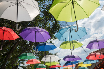 Many colorful umbrellas hanging to decoration outdoor
