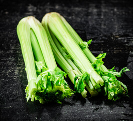 Obraz premium Stalks of fresh celery on the table. 