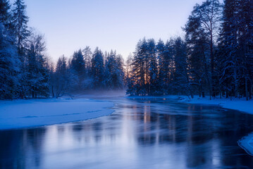 Frosty morning in a wintry river landscape. Farnebofjarden national park in north of Sweden.