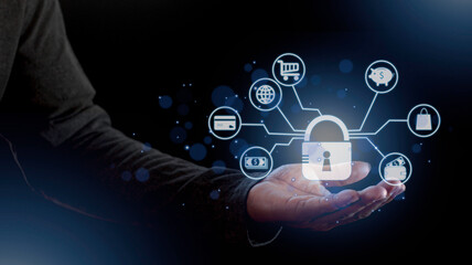 cyber security internet and networking concept. Businessman hand working with VR screen padlock icon on computer background