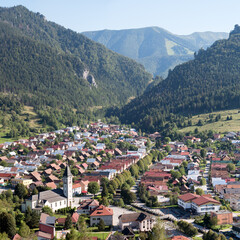 Fototapeta na wymiar Slovakian village Terchova in a valley between Fatra mountains. Hills and rock, blue sky.