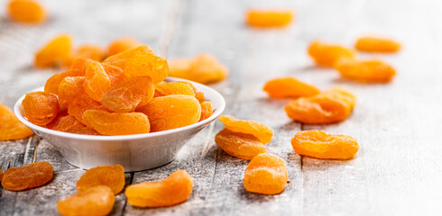 Fragrant dried apricots in a bowl on the table. 