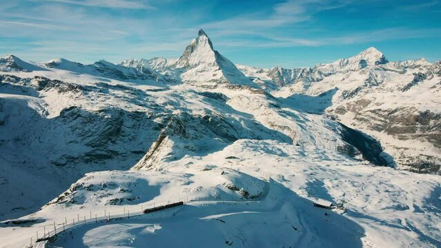 Aerial view, Matterhorn mountain and gornergrat train in sunny winter, Swiss Alps, Zermatt, Switzerland. Tourist journey trip concept