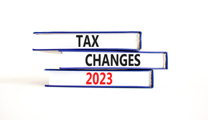 Tax changes 2023 symbol. Concept words Tax changes 2023 on books on a beautiful white table white background. Business Tax changes 2023 concept. Copy space.