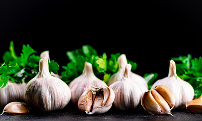 Fragrant garlic with parsley on the table. 