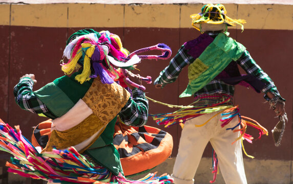 people singing and dancing in colorful clothes and women with picturesque skirts at the cotabamba carnival se&ntilde;or de animas in apurimac peru, october 2020