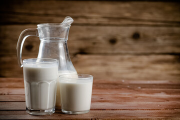 Milk in jugs and glasses. 