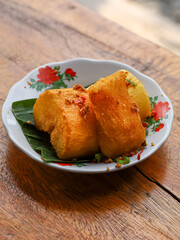 Singkong goreng is a traditional dish originating from Indonesia. Indonesian fried cassava is served while still hot and crispy.