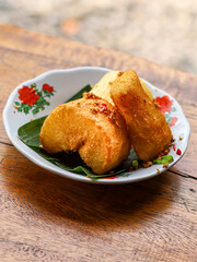 Singkong goreng is a traditional dish originating from Indonesia. Indonesian fried cassava is served while still hot and crispy.