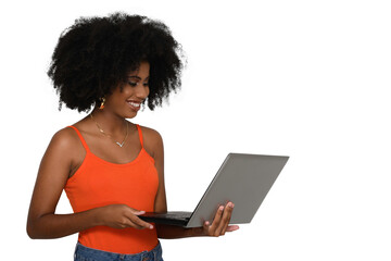 Fototapeta na wymiar young woman looks at camputer laptop screen and smiles, black woman 