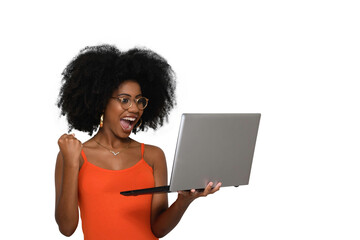 woman looks at laptop screen and gestures with her hand in positive celebration. woman young afro