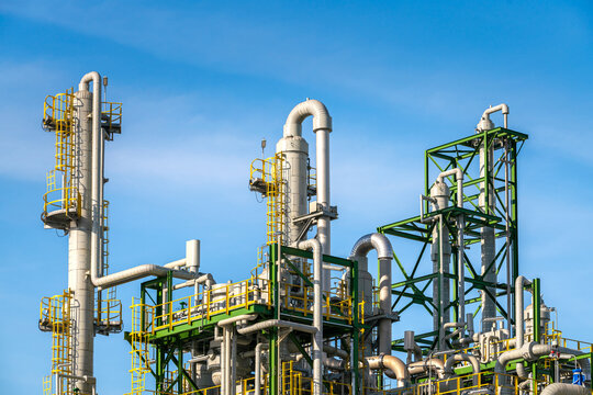 oil and gas tank distillation reactor column in chemical refinery industry petrochemical business to pipeline and storage tank for transportation network ecosystem energy concept
