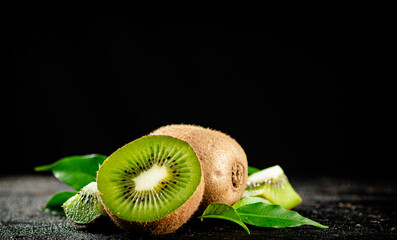 Half a juicy kiwi on the table.  © Artem Shadrin