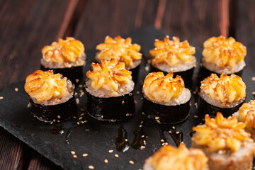 Japanese salmon sushi with spicy mayonnaise - Sushi menu norimaki and uramaki. Asian cuisine concept
