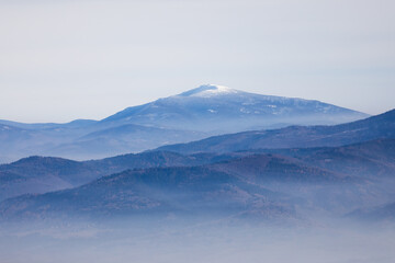 Misty mountains landscape in winter in Poland