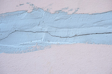 Background of damaged cement wall with cracks
