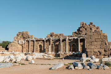 Fototapeta premium Side Agora (State Agora) - ruins of the ancient city of Side, at summer with clear sky and moon.