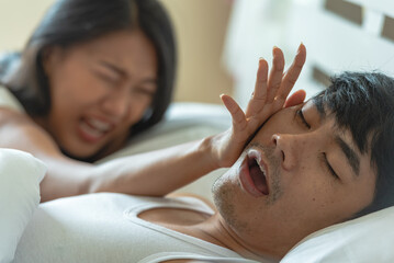 Husband snoring in bedtime. wife suffer unhappy and not sleeping because noise from snoring