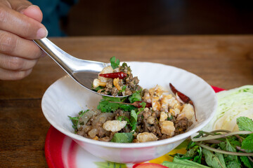 Spicy minced pork salad, Larb Moo, famous traditional Thai food of Northern Thailand.