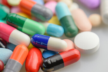 capsules tablets pill on white table. light shiny to blister pack of the capsules