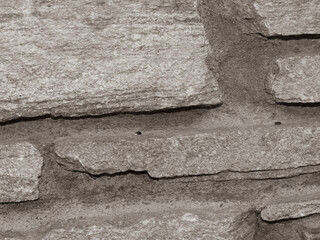 Old grungy stonewall . Strong texture for background backdrop