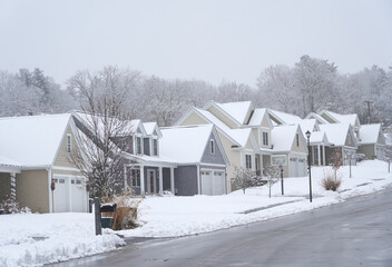 houses in residential community after snow in winter 